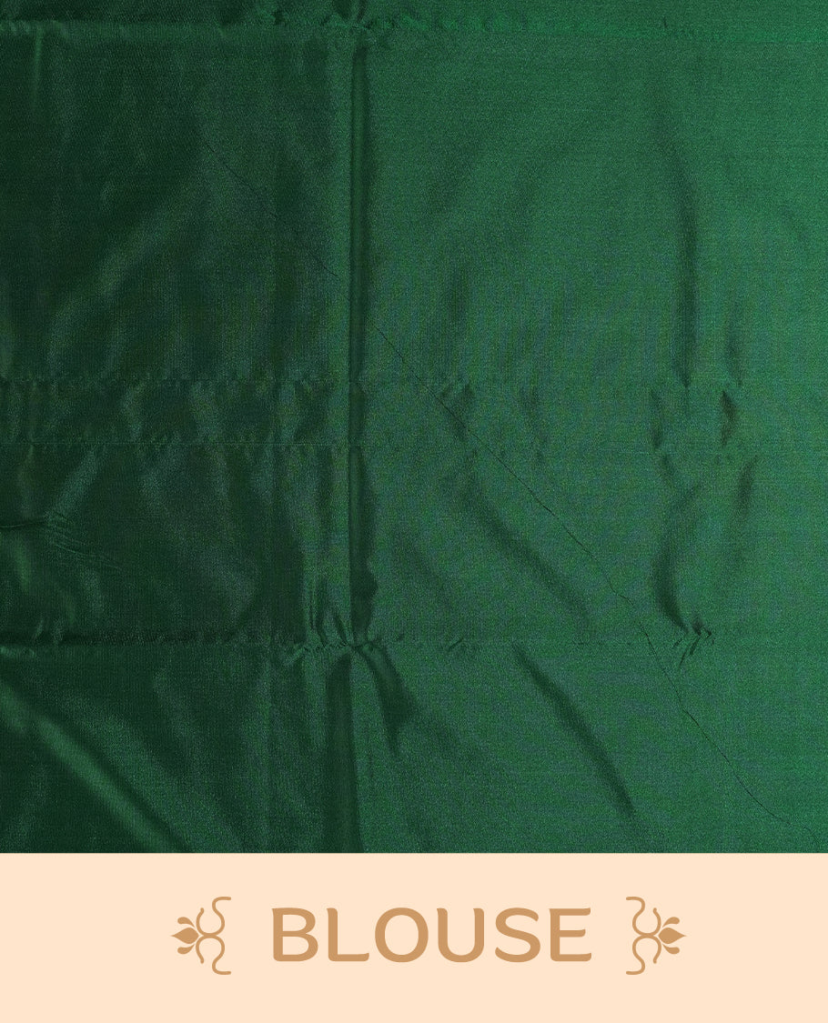 Royal Green colour semi soft silk saree adorned with delicate woven floral motifs on the body, complemented by a rich contrast woven pallu with intricate detailing and tassel accents & Comes with a matching blouse piece.