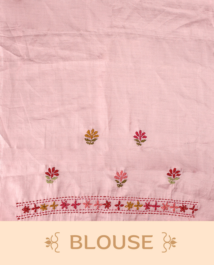 Pink colour pure tussar saree adorned with delicate multicolour floral embroidery along the border and scattered motifs across the body, paired with a matching blouse.