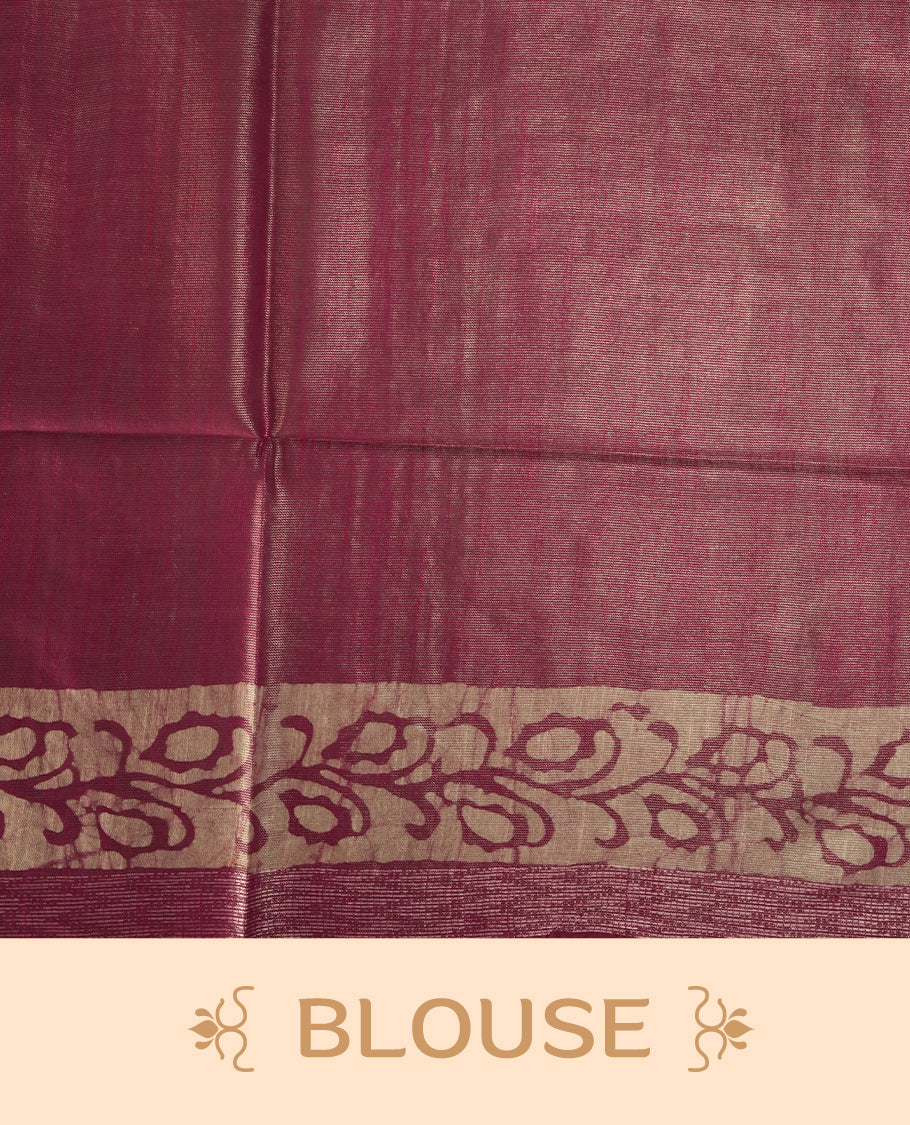 Pink colour semi jute tissue saree featuring delicate wave motifs on the body, complemented by a lustrous zari striped pallu and matching blouse piece for a refined festive look.