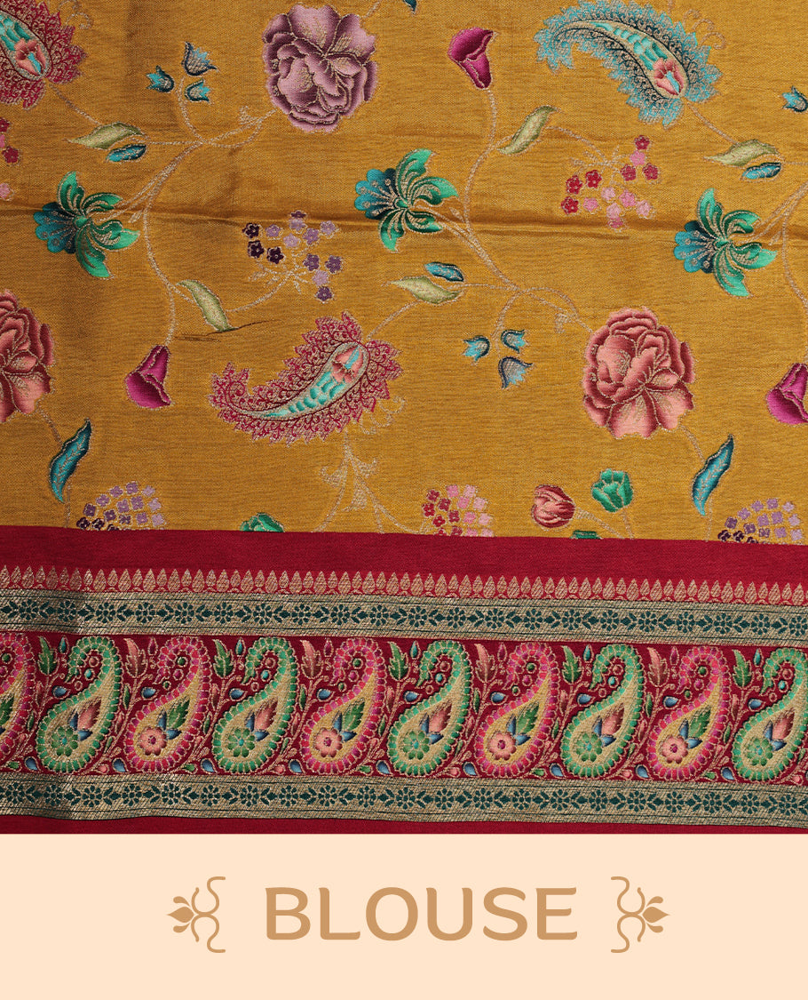 Mustard yellow colour Pashmina silk saree features an all over floral body, a contrast crimson red paisley border and pallu, and a matching unstitched blouse.