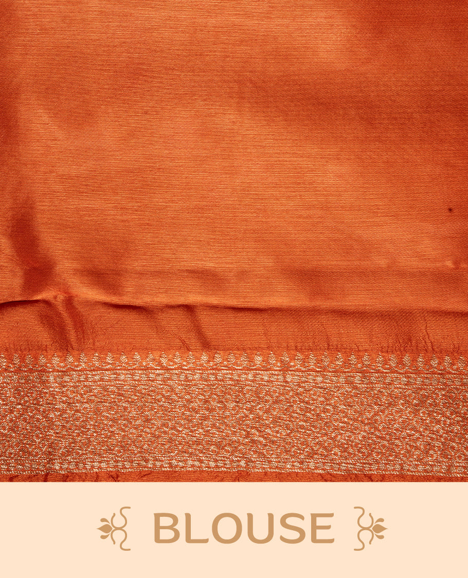 Burnt Orange colour Semi Banaras Tussar Georgette Featuring Gold zari Leaf pattern on body, Finished with Gold zari border and paired with matching blouse piece.