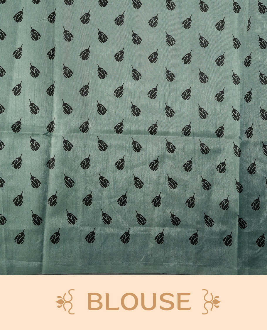 Pastel green colour saree with black floral prints all over the body, complemented by a contrasting black pallu adorned with bold floral designs and striped detailing & Paired with a matching blouse for a complete look.
