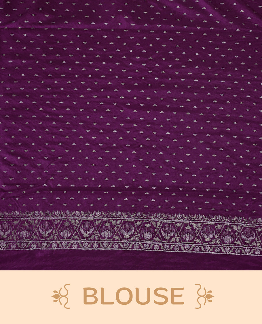 Rich purple Banaras soft silk saree with all over silver zari floral vines, ornate woven border, and bold pallu with paisley motifs. Comes with a matching blouse & Ideal for weddings and festive occasions.