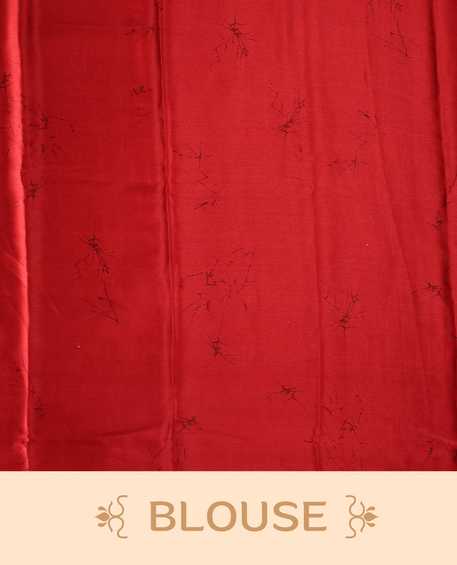 White and red semi modal saree featuring bold floral and abstract patterns across the body and pallu, enhanced with a smooth drape and a matching blouse.