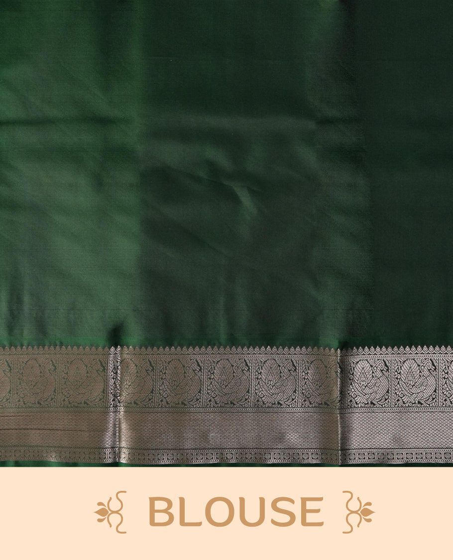 Black colour soft silk saree with green and copper zari border and featuring elegant copper buttas across the body & Paired with a amatching blouse.