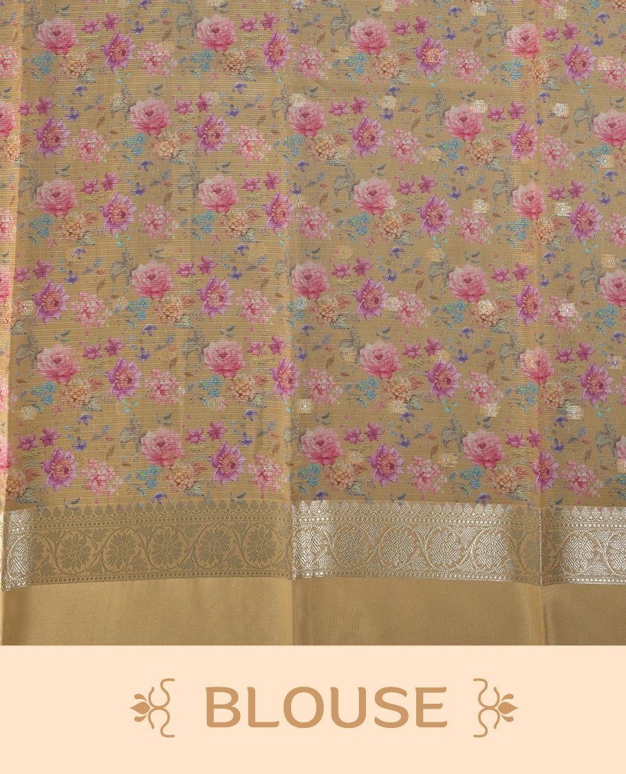 Ivory colour Kotta Tussar Silk saree features a vibrant digital floral print with small gold zari motifs on the body, and elegant banarasi border adds a regal touch & Paired with a matching blouse,blending modern design with traditional elegance.