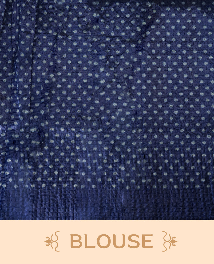 Classic off white colour saree adorned with intricate blue tribal motifs and rich woven patterns on the pallu and border & Paired with matching blouse.