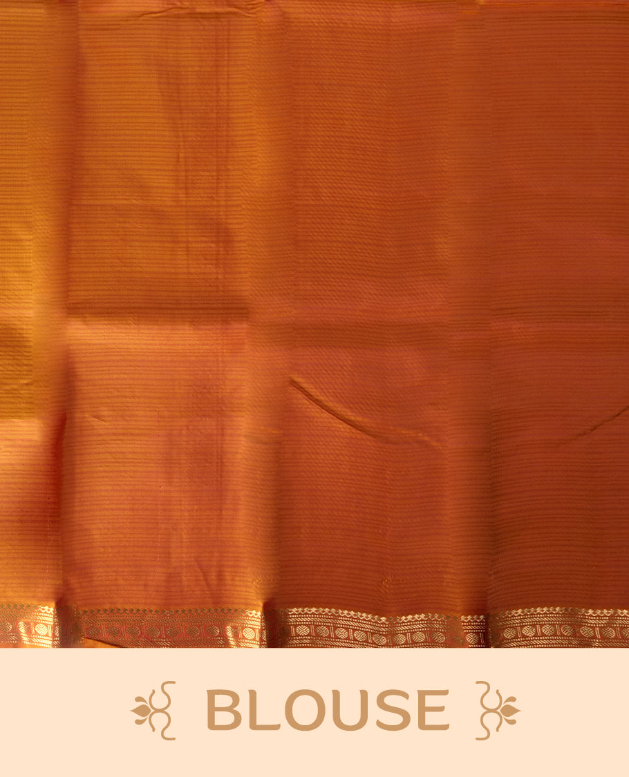 Magenta colour soft silk saree with golden buttas, enhanced by a vibrant orange zari border and pallu, paired with a matching blouse.