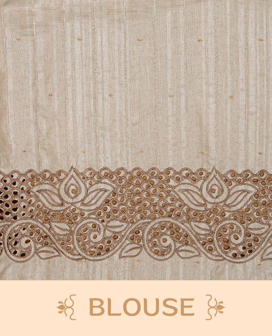 Cream colour Semi Tussar silk saree features an intricate cutwork embroidered peacock motifs on border, paired with a matching unstitched blouse piece.