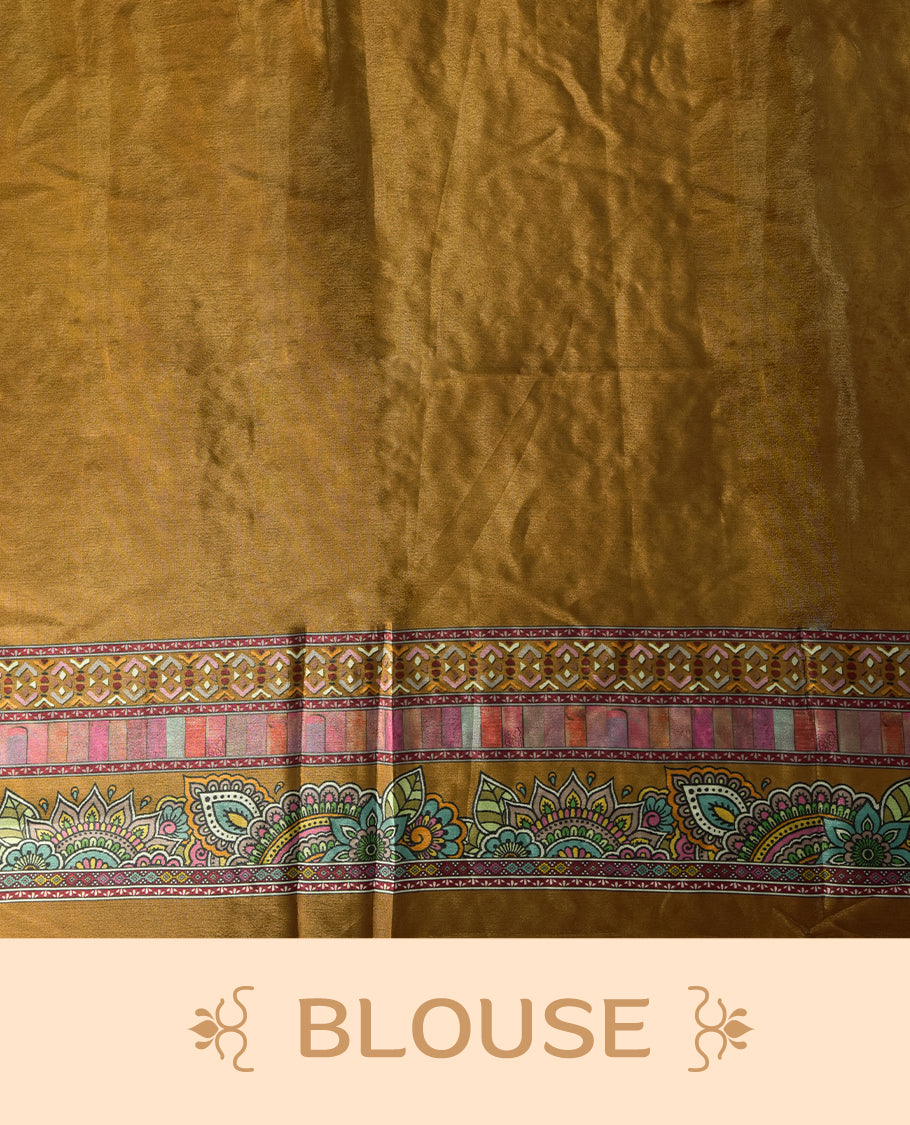 Mustard brown colour saree with intricate multicolor floral and paisley patterns, highlighted by vibrant borders & Paired with a matching blouse.