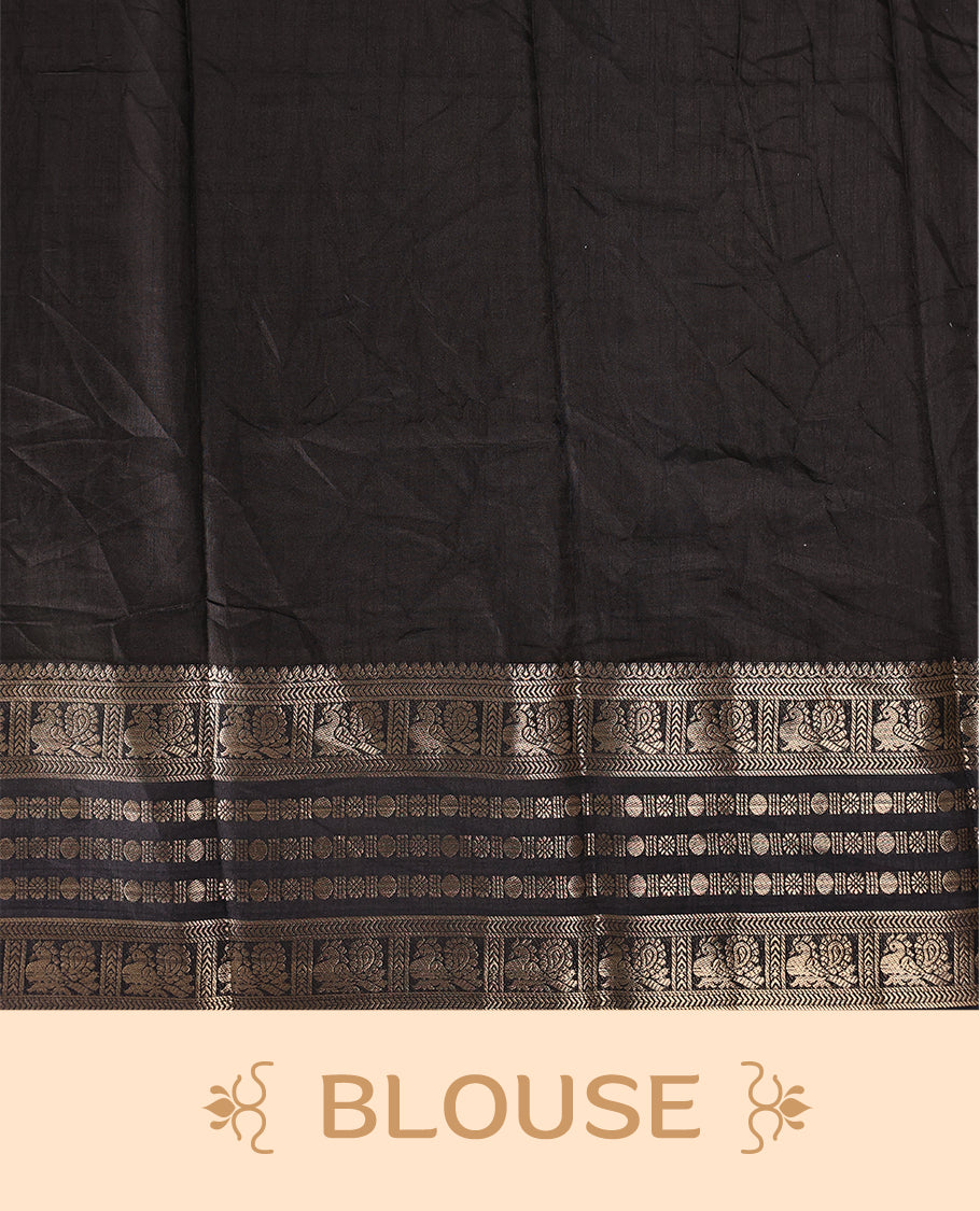 White colour saree adorned with striking black floral and cow prints across the body, enhanced by a rich black border for bold contrast, and paired with a matching blouse