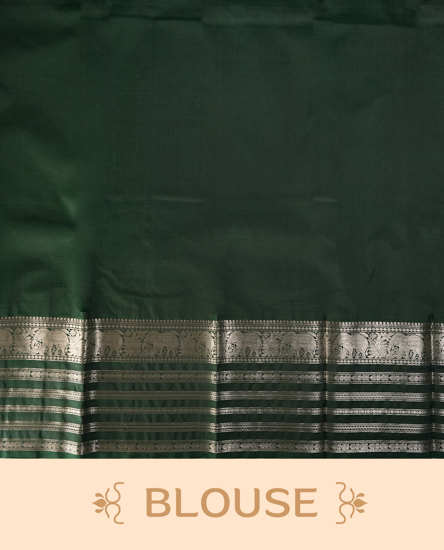 Pink and green colour soft silk saree with rich silver zari border and buttas, paired with a matching blouse.