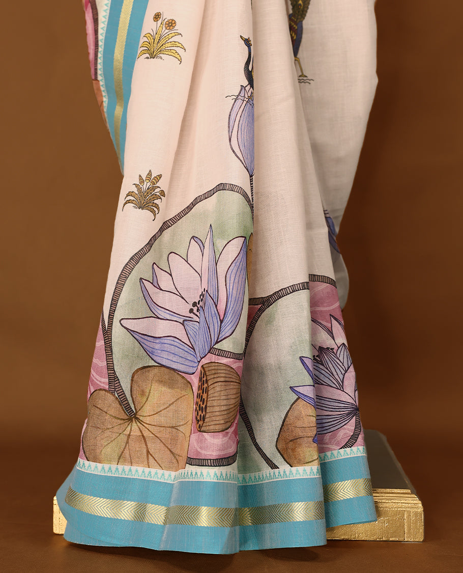 Off-white Colour lightweight khadi cotton saree featuring earthy-coloured digital floral kodi prints on the body and pallu, accented with a Blue border paired with a matching blouse.
