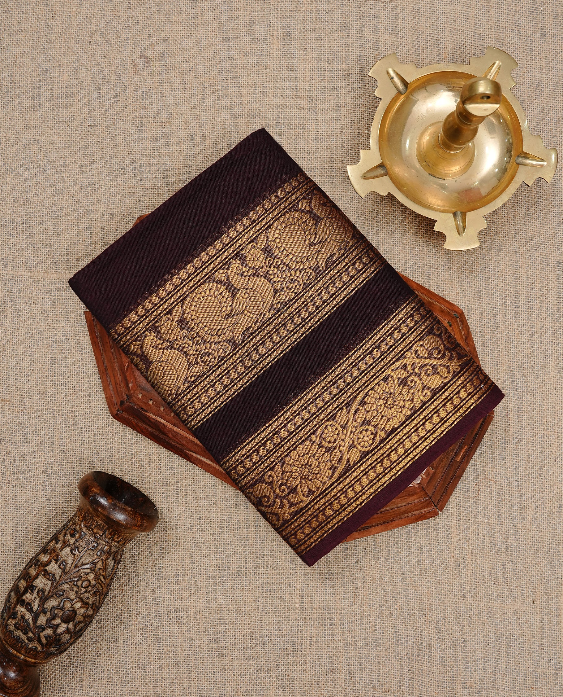 Chocolate Brown colour Chettinad cotton saree featuring Elegant plain body , complemented by self colour with zari border, comes with matching blouse piece.