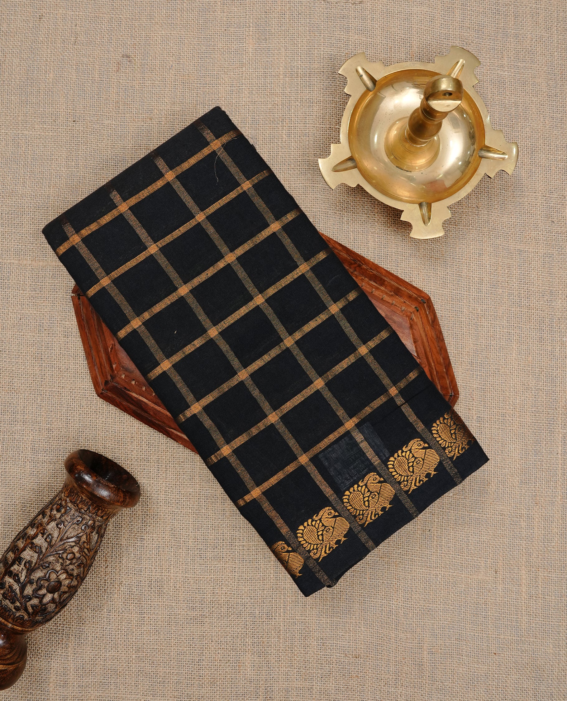 Black colour Sungudi cotton saree featuring Gold zari Check pattern on body, Gold zari Peacock design on Self colour border, paired with matching blouse piece.