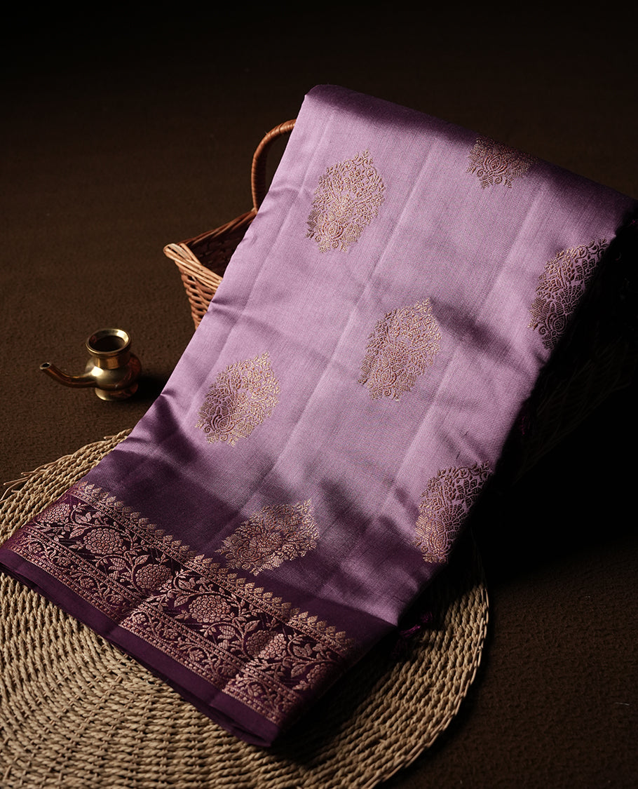 Pastel Pink Colour Banaras Soft Silk Saree with Gold Zari Textured Oval Buttas, Simple Decorative Pallu Border, Grand Pallu with Ornate Floral and Foliate Motifs in Deep Maroon and Gold Tones, and Matching Deep Maroon Blouse.