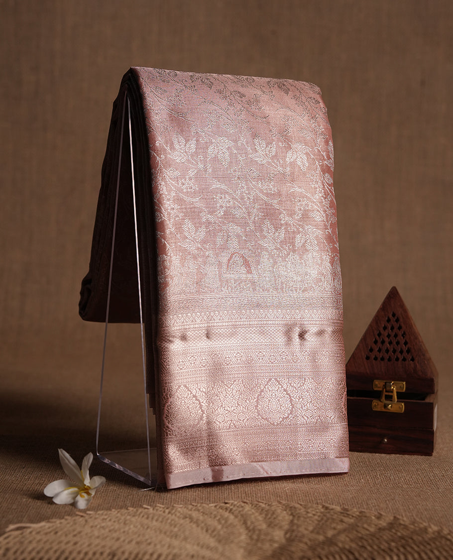 Peach colour and rose gold Zari Tissue Brocade Saree features intricate Motifs on body and rose gold colour traditional border & pallu, paired with matching blouse