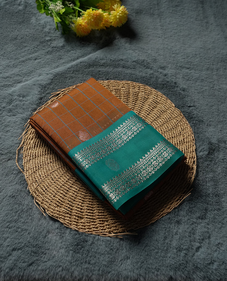 Orange Silk Cotton Saree with White Floral Buttas Body, Accented by White Lotus and Geometric Pattern on Green and Blue Zari Pallu, Paired with Matching Blouse Piece