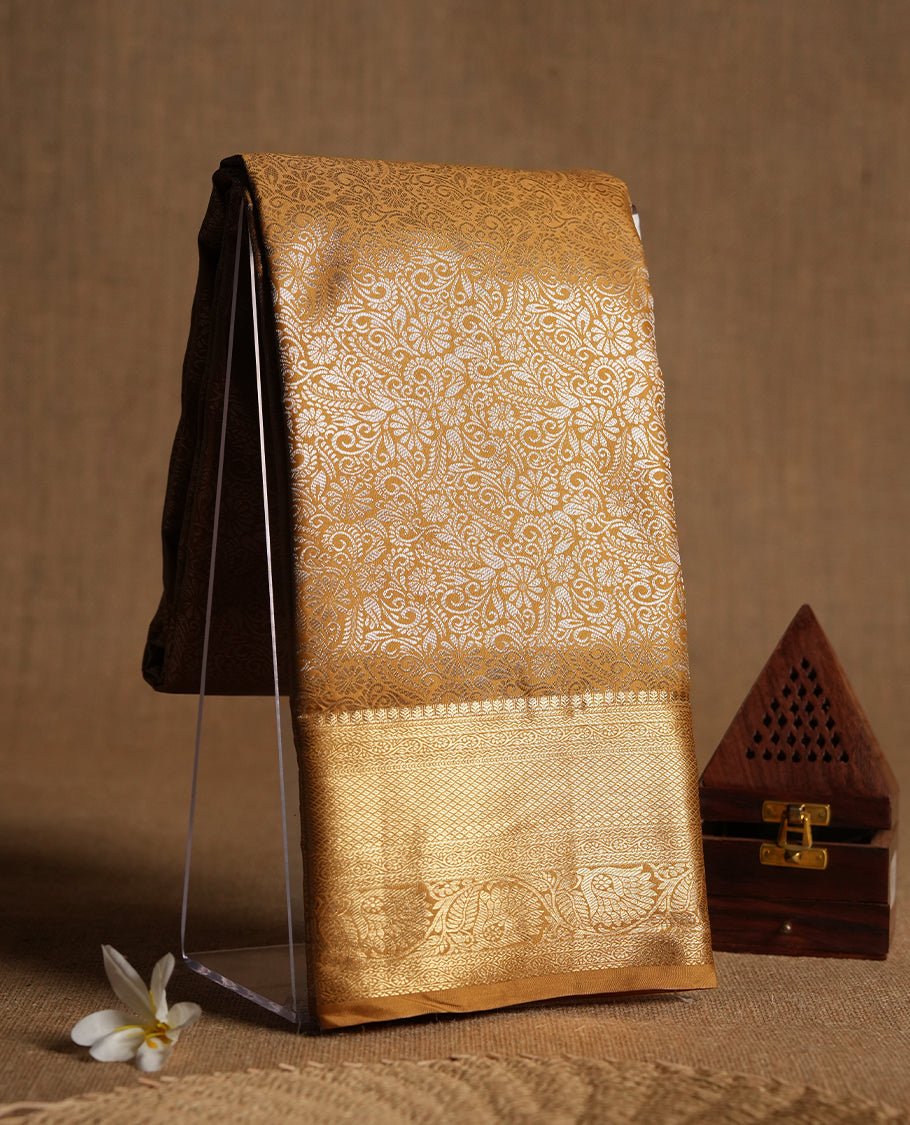 Yellowish Gold colour and silver Zari Tissue Brocade Saree features intricate floral Motifs on body and golden colour traditional border & pallu, paired with matching blouse