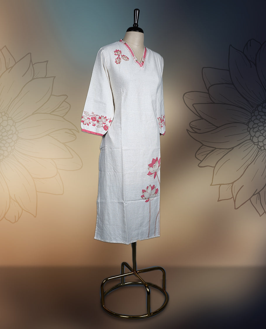 Off white colour kurthi with delicate pinkish peach floral embroidery on the neckline, sleeves, and hem, Featuring a stylish V neck and three quarter sleeves, perfect for a graceful and comfortable look.