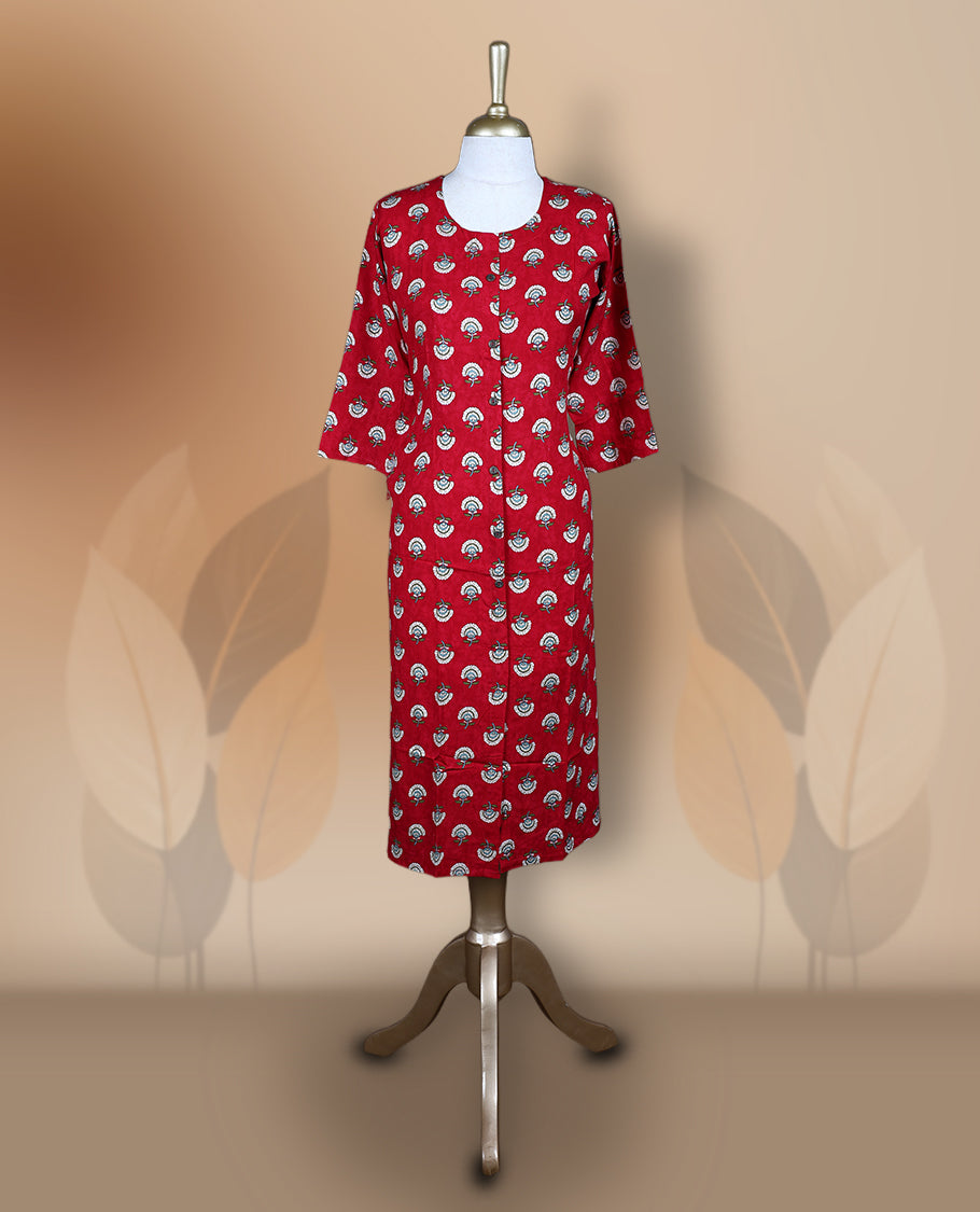 Red kurti featuring a round neckline, 3/4th flared sleeves, and an all over white and teal floral motif print, styled in a straight cut silhouette for a vibrant and elegant casual wear look.