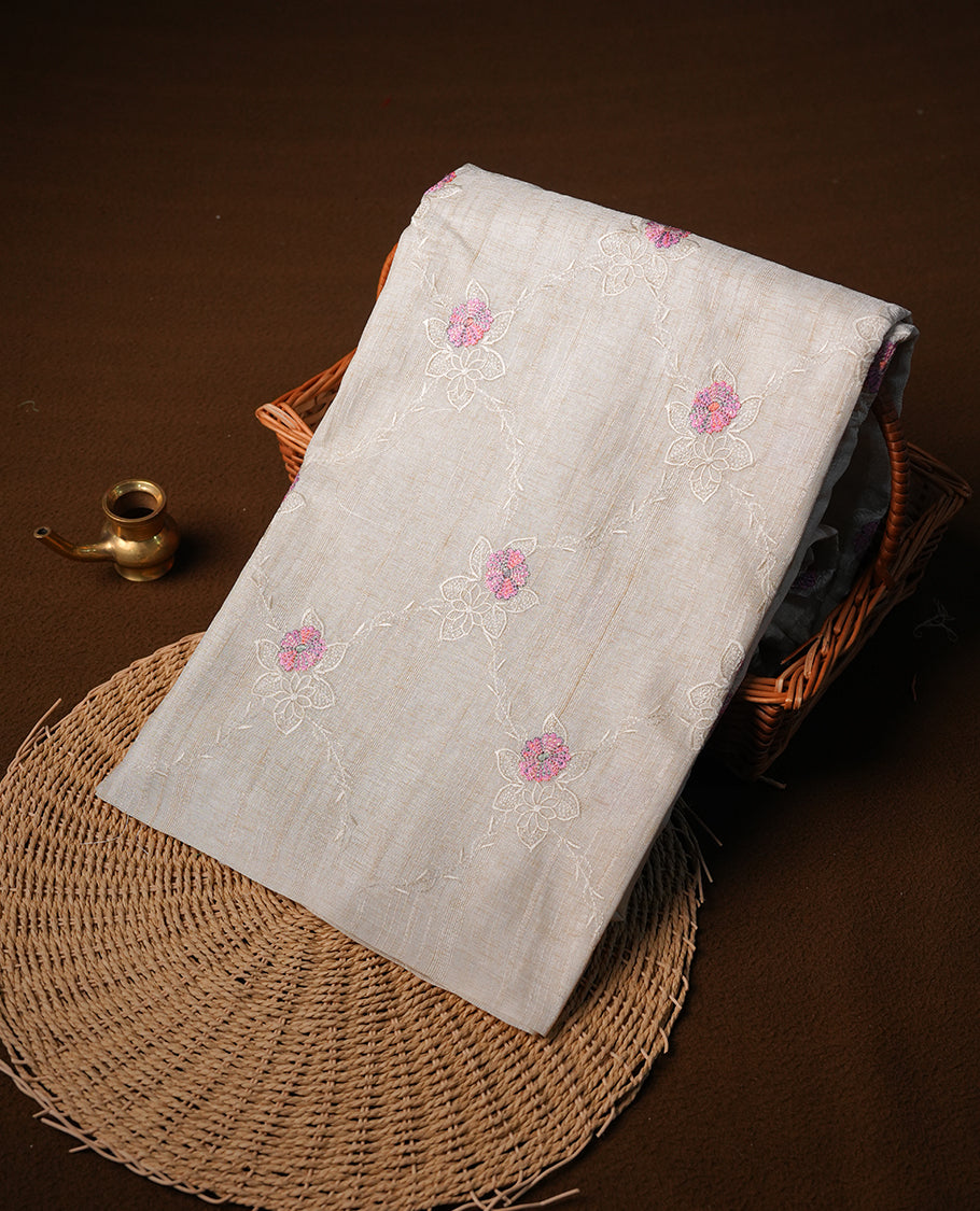 Cream colour semi tuseer silk saree featuring with Self colour thread embroidery kodi pattern & Pink colour floral thread motifs all over body, pallu, and paired with matching blouse piece.