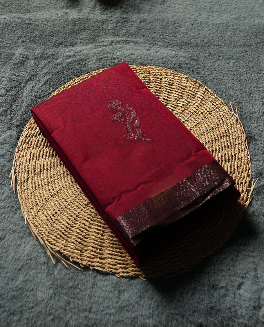 Maroon Red Colour Silk Cotton Saree with Dark Silver Floral Butta Body, Self Coloured Dark Silver Zari Pallu & Border, Floral Vine Motifs, and Matching Plain Woven Blouse Piece