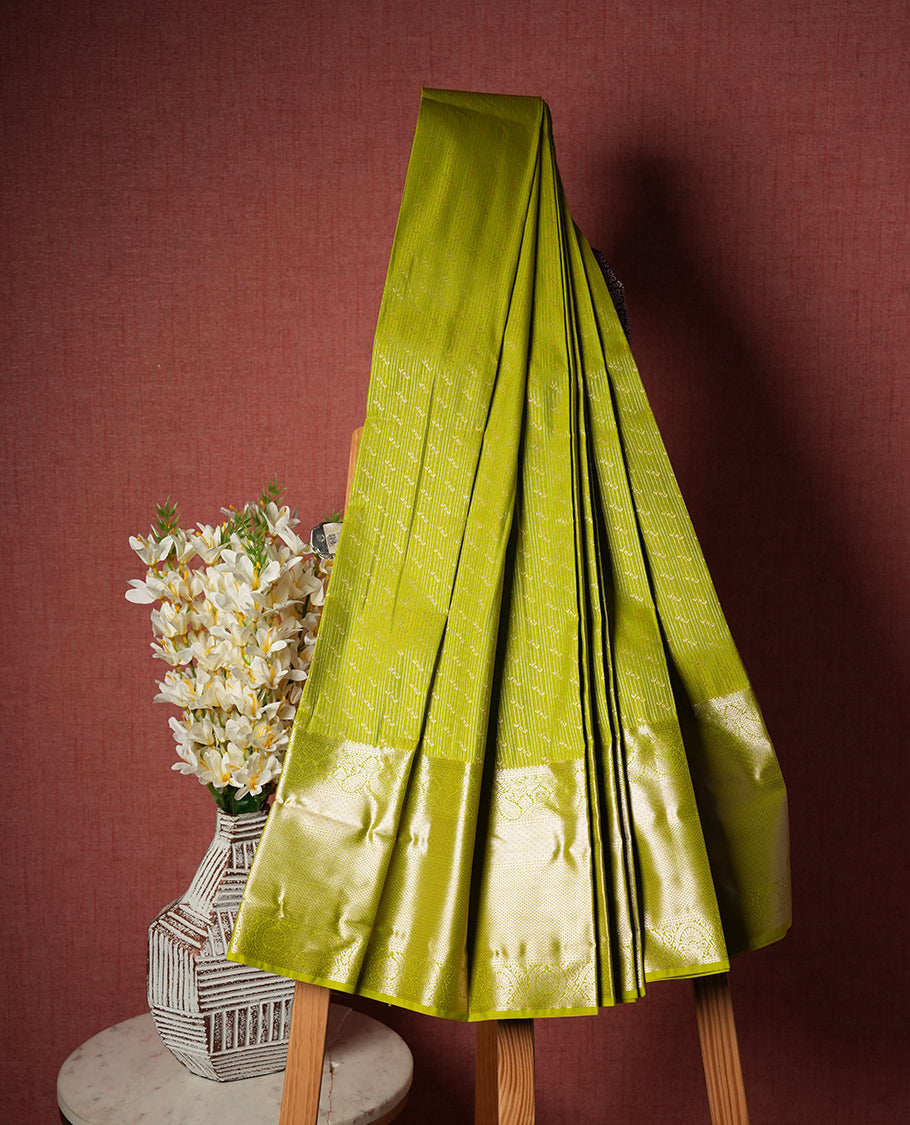 Lime Green Colour Semi Silk Saree with Silver Diagonal Butta Body, Self Coloured Silver Zari Pallu & Border, Paisley Motifs, and Matching Blouse Piece