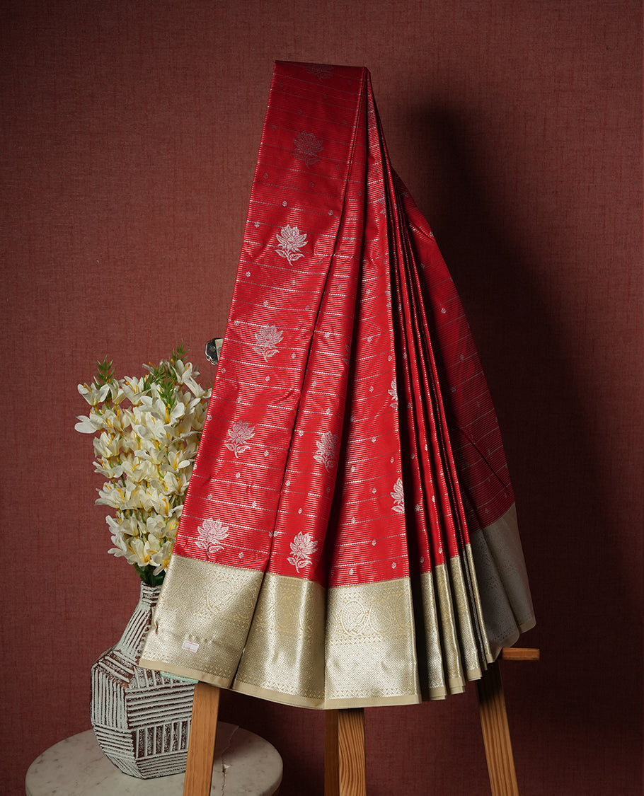 Red colour Semi Silk Saree with silver zari patterns on the body, paired with a contrasting cream colour traditional pallu and border, and a matching blouse piece.