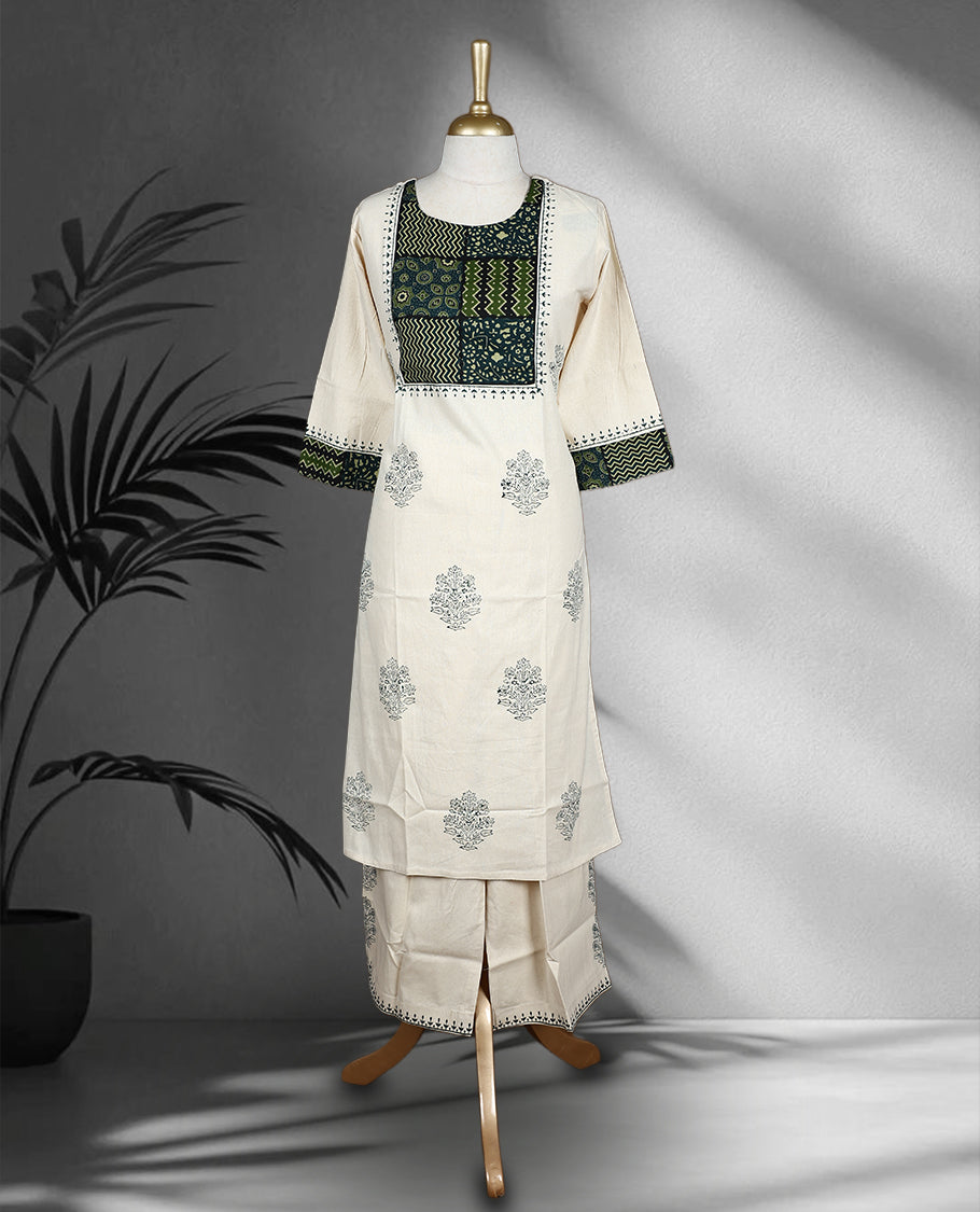 Off white colour cord set with delicate grey motifs, featuring a round neck top with patchwork detail in green and black, and matching embroidered straight fit pants.