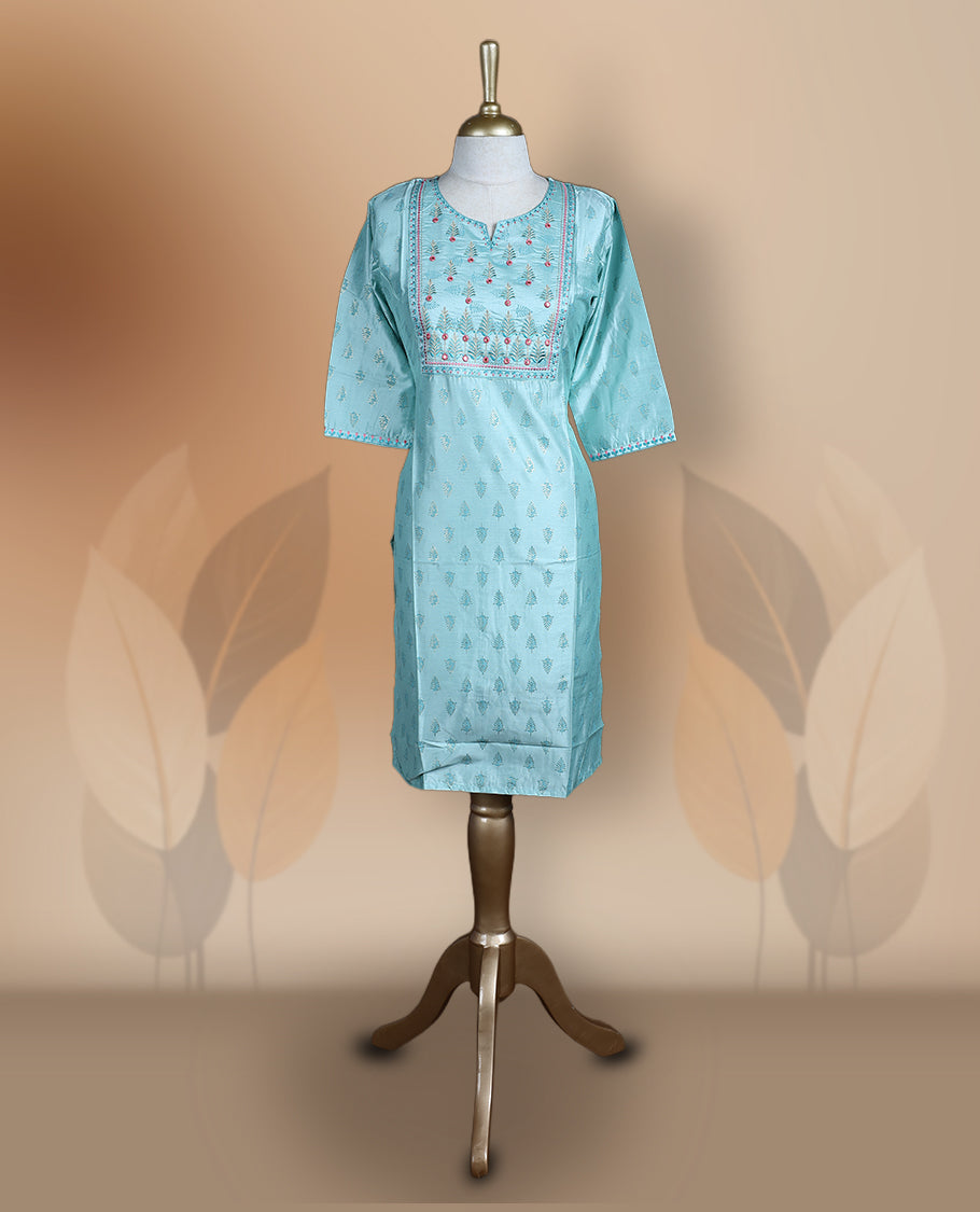 Light blue silk blend kurthi with intricate embroidered yoke, subtle butti prints, and elbow length sleeves & A perfect blend of tradition and style for festive or casual wear.