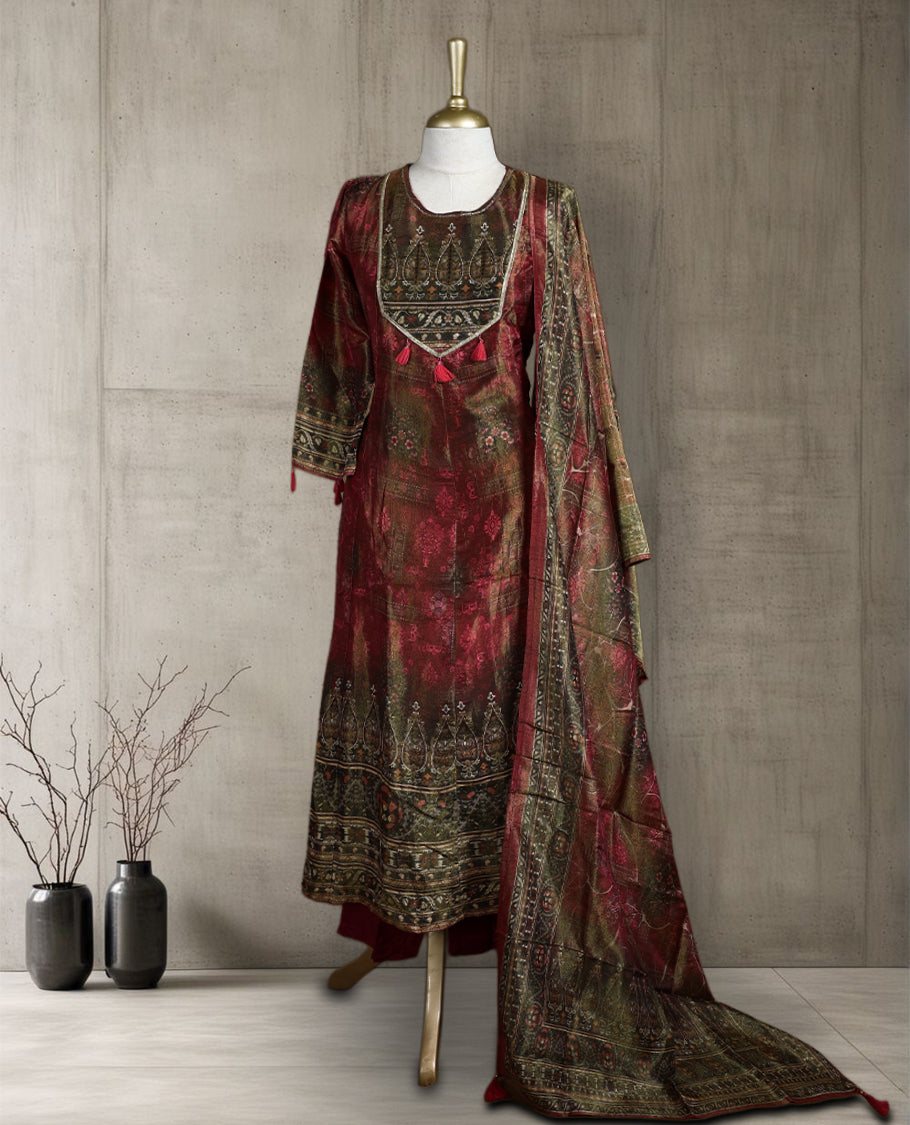 Maroon and olive green salwar from TWARA, featuring a round neck with intricate zari embroidery and tassel detailing, paired with a matching bottom and a richly woven dupatta showcasing traditional motifs.