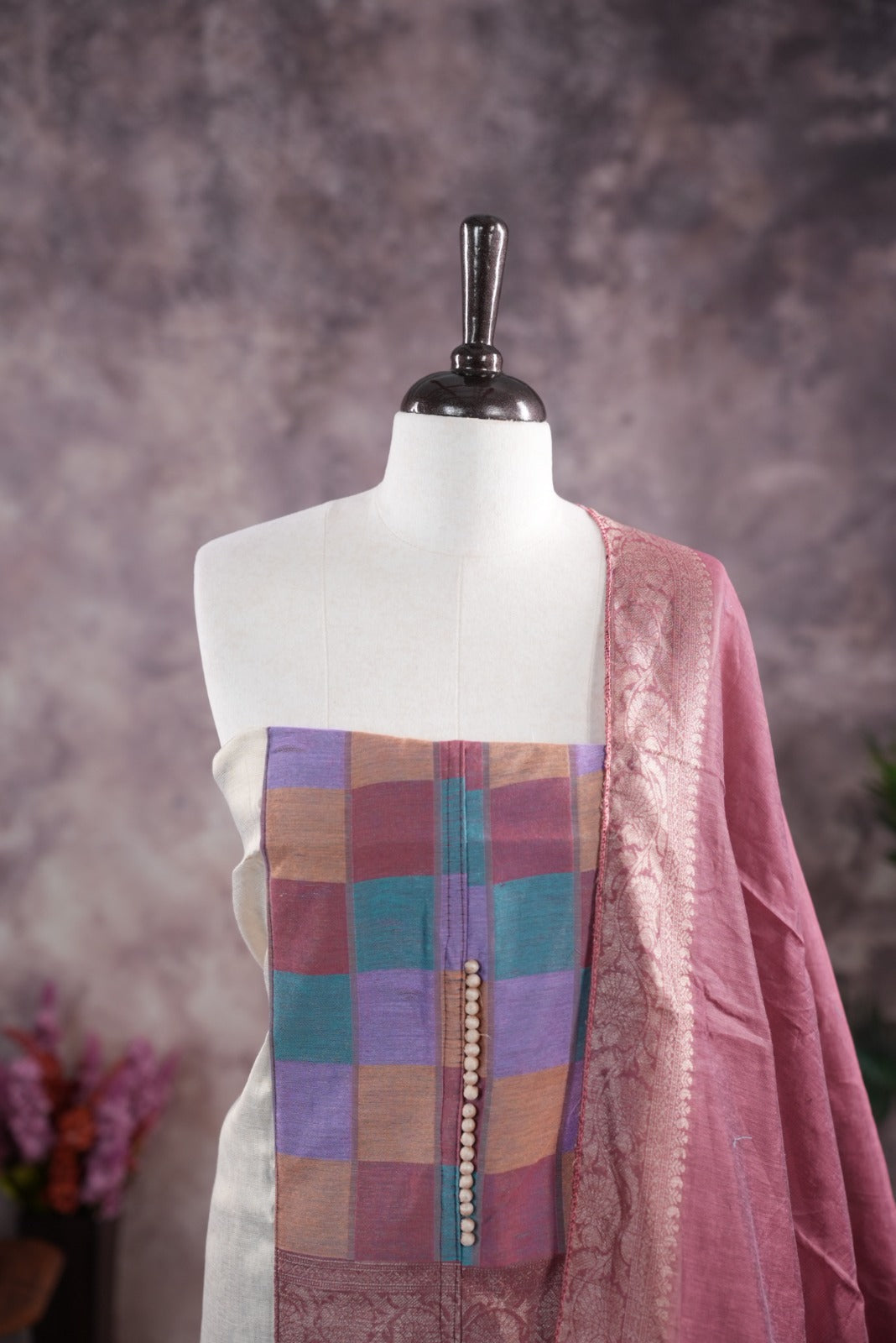 Onion pink colour tissue Madras check salwar material featuring a plain body with a classic Kasavu border, paired with a Chanderi dupatta adorned with a matching Kasavu border and a Shantoon fabric bottom.