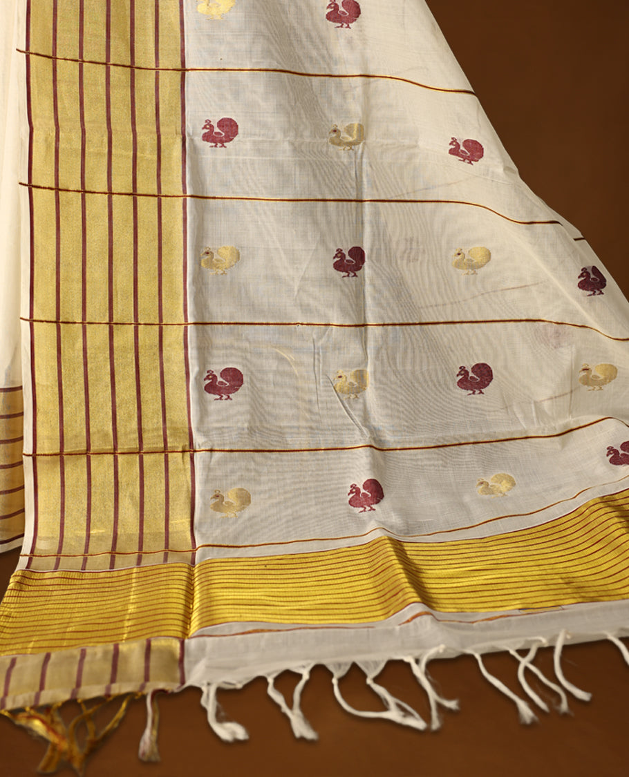 Elegant pure handloom cotton Kerala saree with a cream base, gold zari stripes, maroon & gold floral motifs. Paired with a matching blouse, it’s perfect for festive celebrations and traditional occasions.