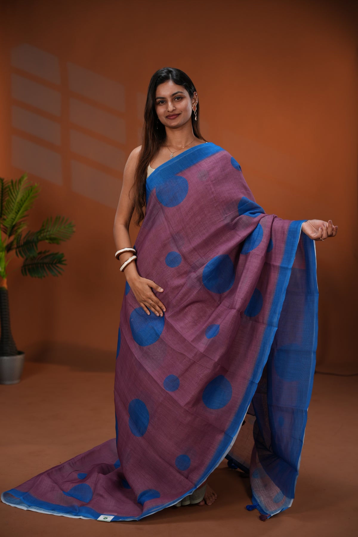 Wine colour Linen saree featuring Blue Polka dot on body, Contrast Border and Blouse.