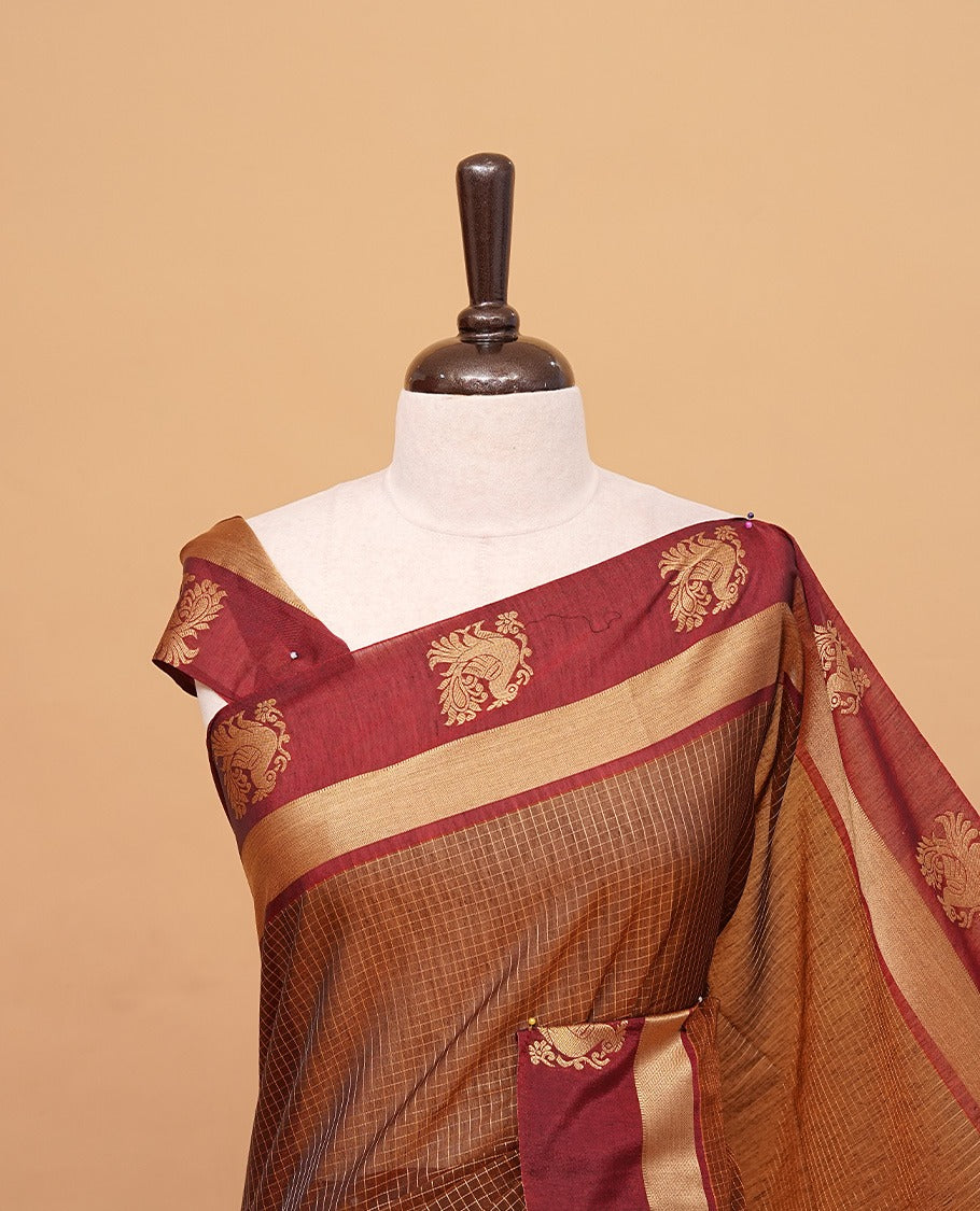 Brown colour silk cotton saree featuring copper zari Check motifs on body ,contrast maroon with copper zari motifs on border & pallu, comes with matching blouse piece