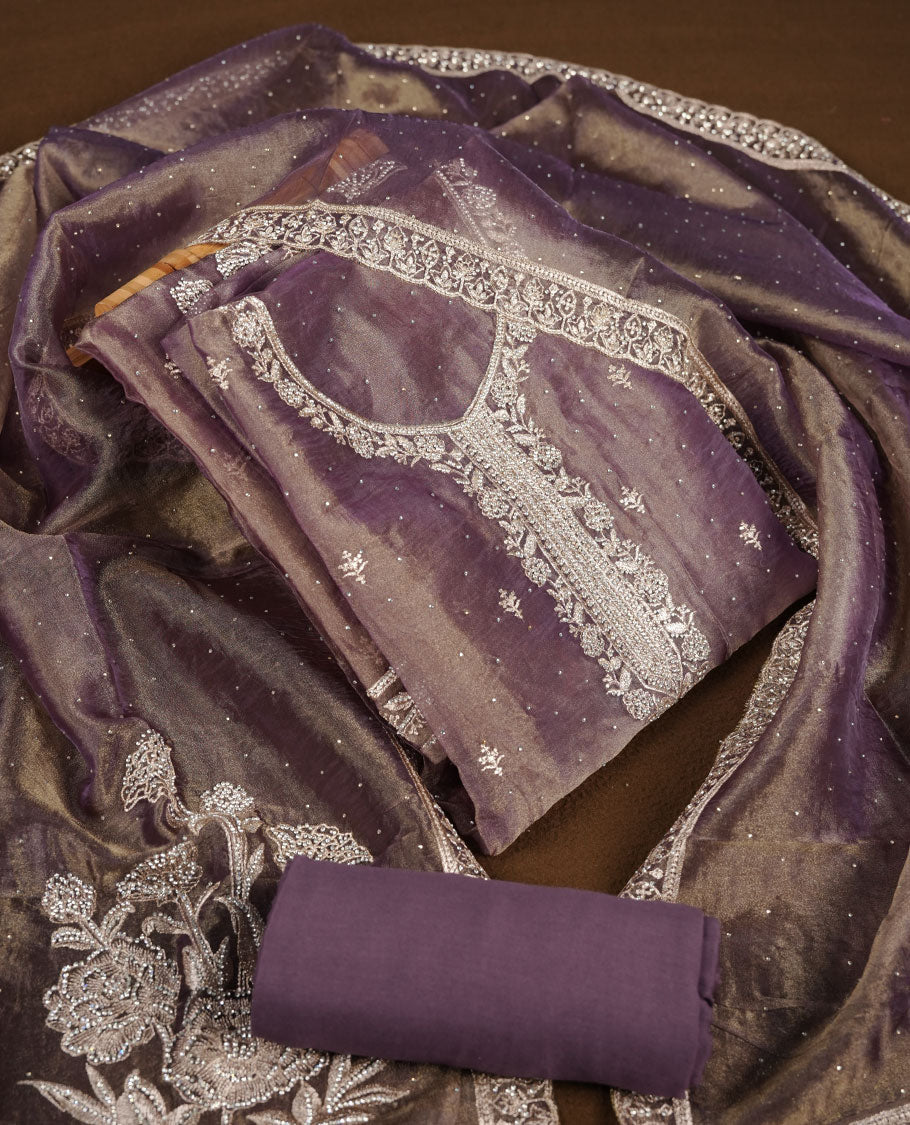 Purple and gold double shade colour churidar set with stone and thread embroidery and detailing, paired with matching pant and dupatta.