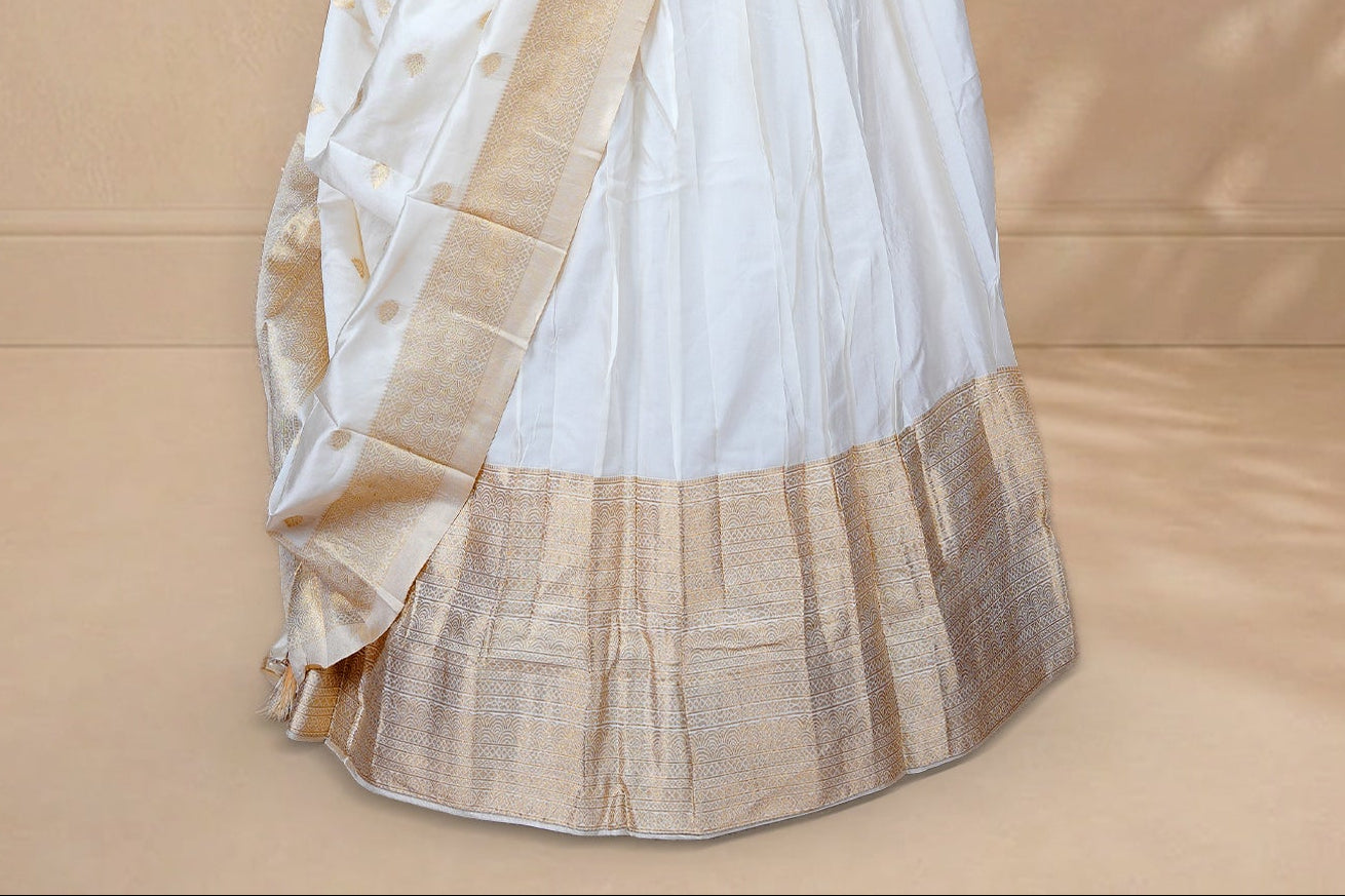 Cream colour Half saree featuring Plain skirt with Zari border on Self colour border, Unstitched Blouse and matching dupatta.