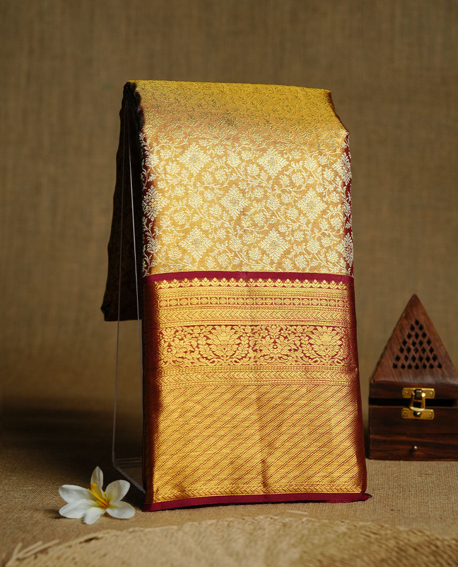 Gold & Maroon double shade colour kancheepuram tissue silk saree featuring gold zari floral kodi pattern on body, complemented by contrast maroon colour with traditional border, paired with matching blouse piece.