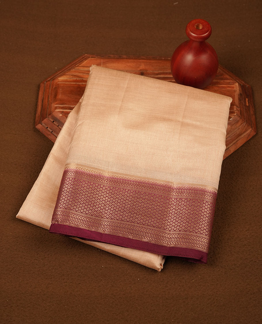 Cream colour tussar silk saree featuring elegant plain body, contrast Maroon colour border with gold zari, comes with matching blouse piece.