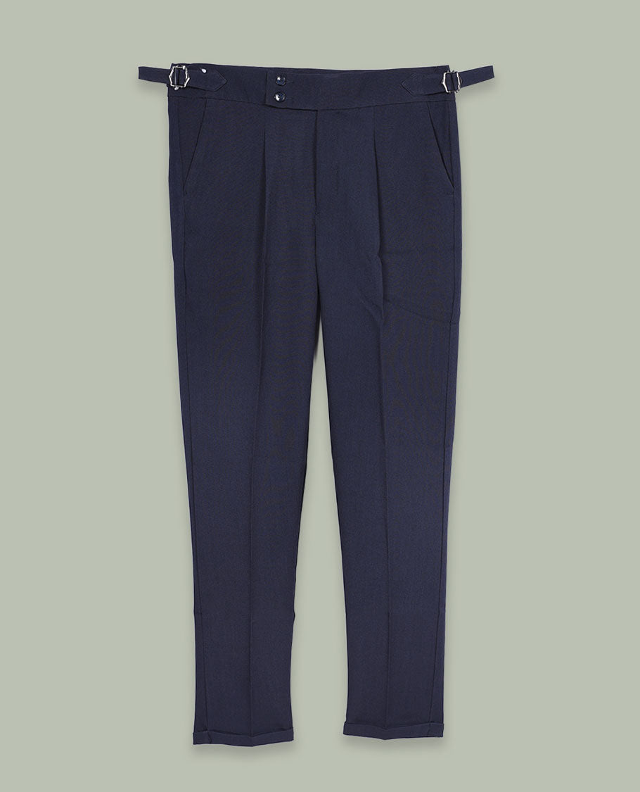 Navy blue colour men’s pant featuring a clean waistband with side buckle adjusters, neat front pleats, slant pockets and back welt pockets, finished with a straight leg fit.