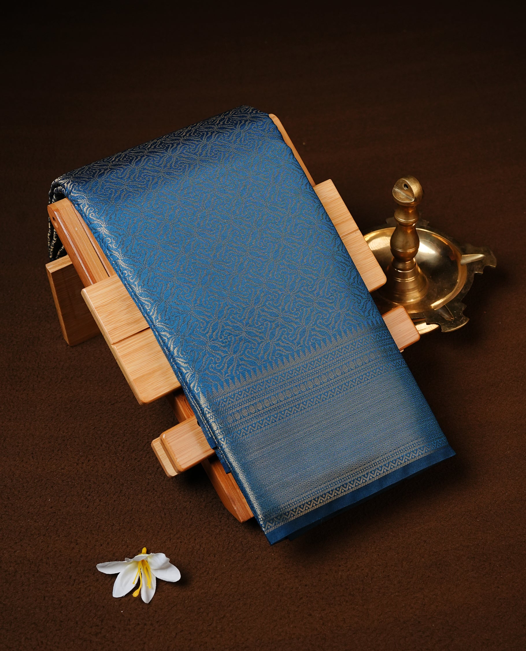 Teal colour Semi Wedding silk saree featuring gold zari kodi pattern across body, complemented by self colour with traditional border, paired with matching blouse piece.