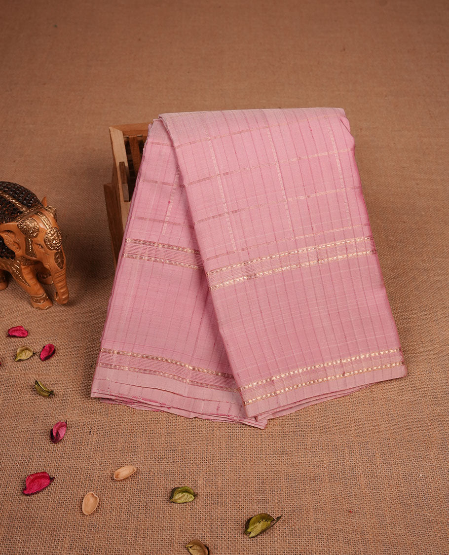 Dusty Pink colour pure traditional Kancheepuram silk saree adorned with gold zari Checks across the body, featuring simple borders, beautifully paired with a matching blouse piece.