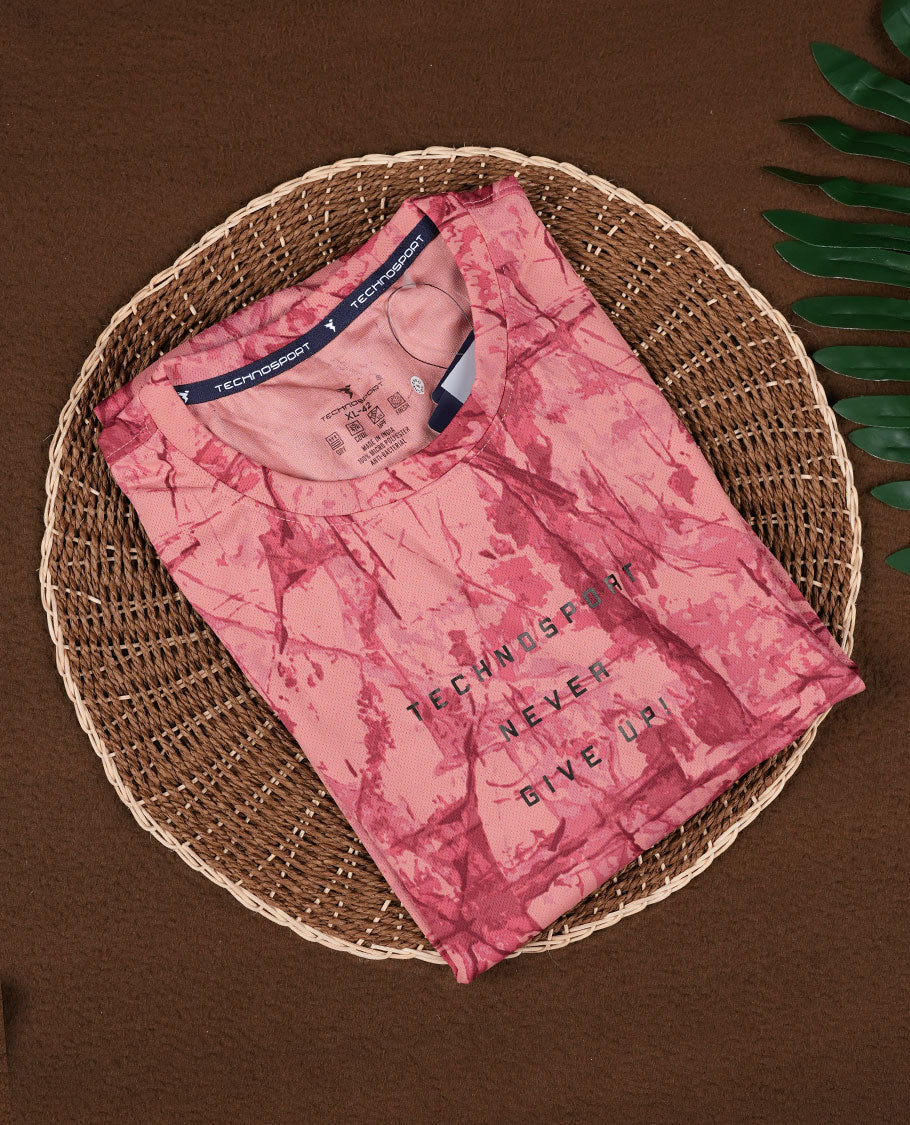 Light coral colour T shirt featuring a bold abstract tie dye pattern in darker red tones, designed with a classic round neck and short sleeves for a relaxed and stylish everyday look.