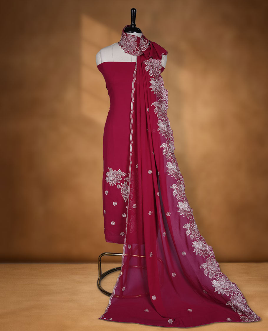 Reddish Maroon colour georgette salwar material with elegant thread work on the body, paired with a flowy dupatta featuring delicate detailing, and complemented by a plain bottom for a graceful finish.