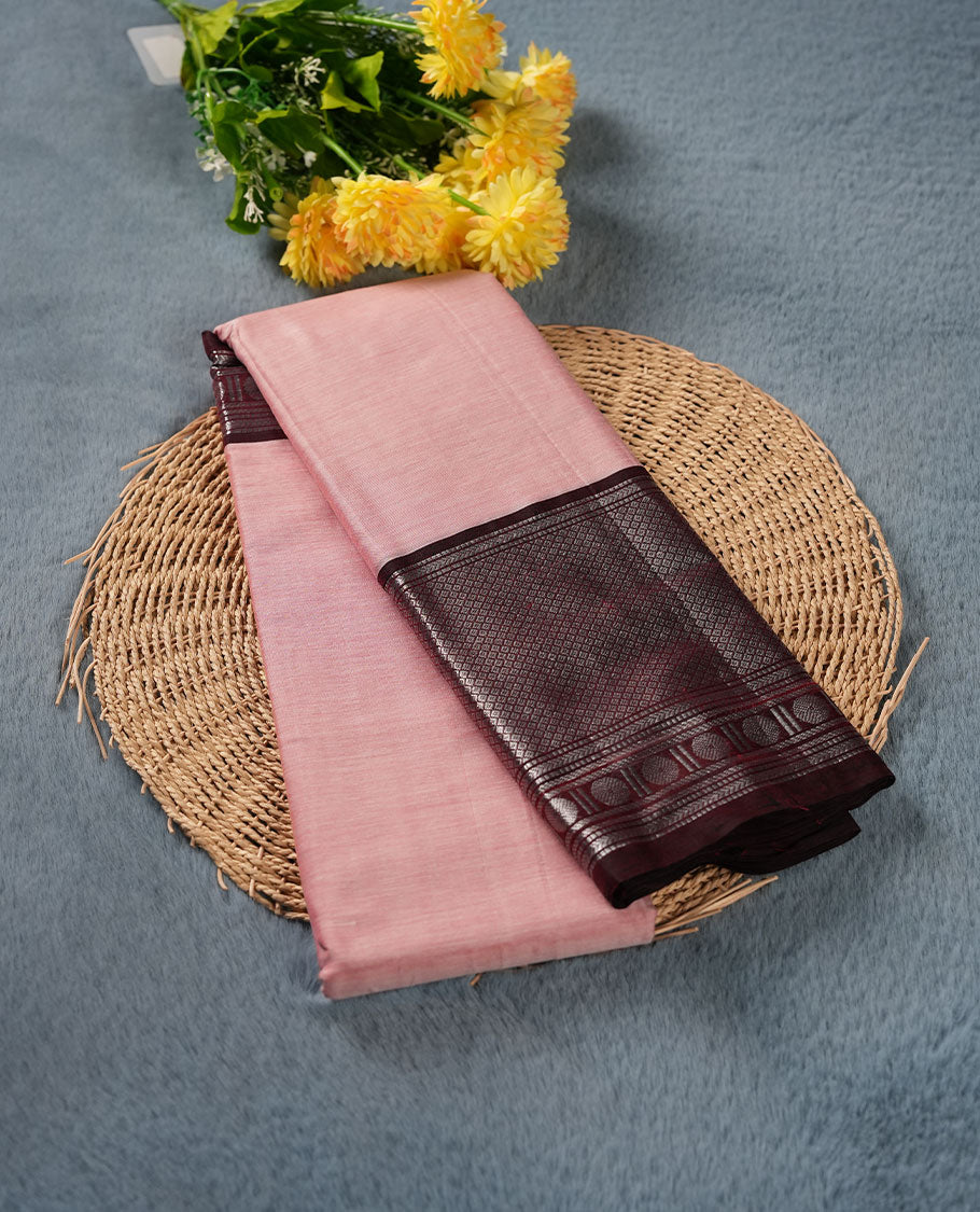 Baby pink colour Narayanapattu cotton saree featuring a self coloured body, contrast Chocolate brown colour with silver zari border and pallu, pairing a matching blouse piece.