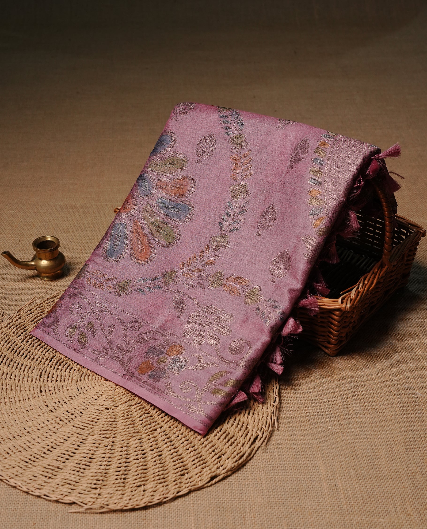 Pink colour pure tussar silk saree featuring elegant antique zari kodi patterns across the body, designed with a graceful borderless finish for a refined look. Paired with a matching blouse piece.