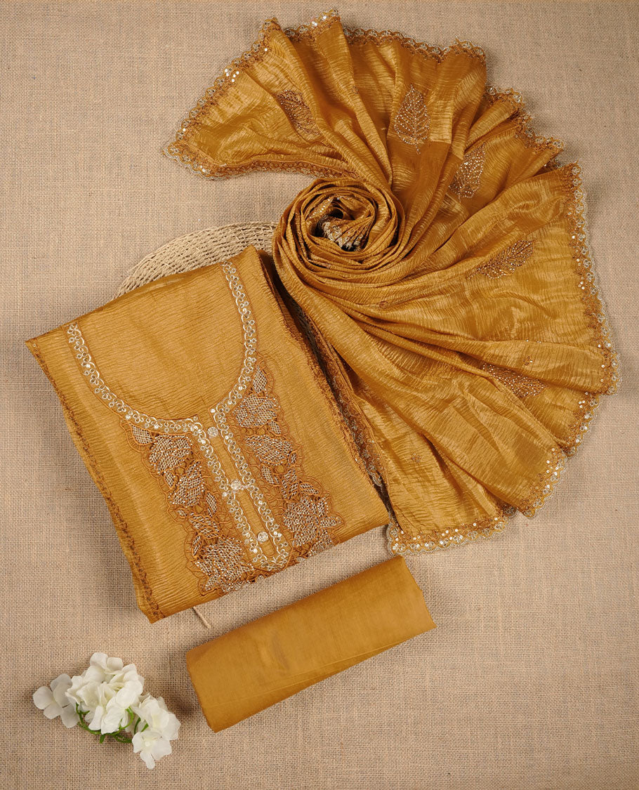 Mustard colour churidar set with stone and thread embroidery and detailing, paired with matching pant and dupatta.