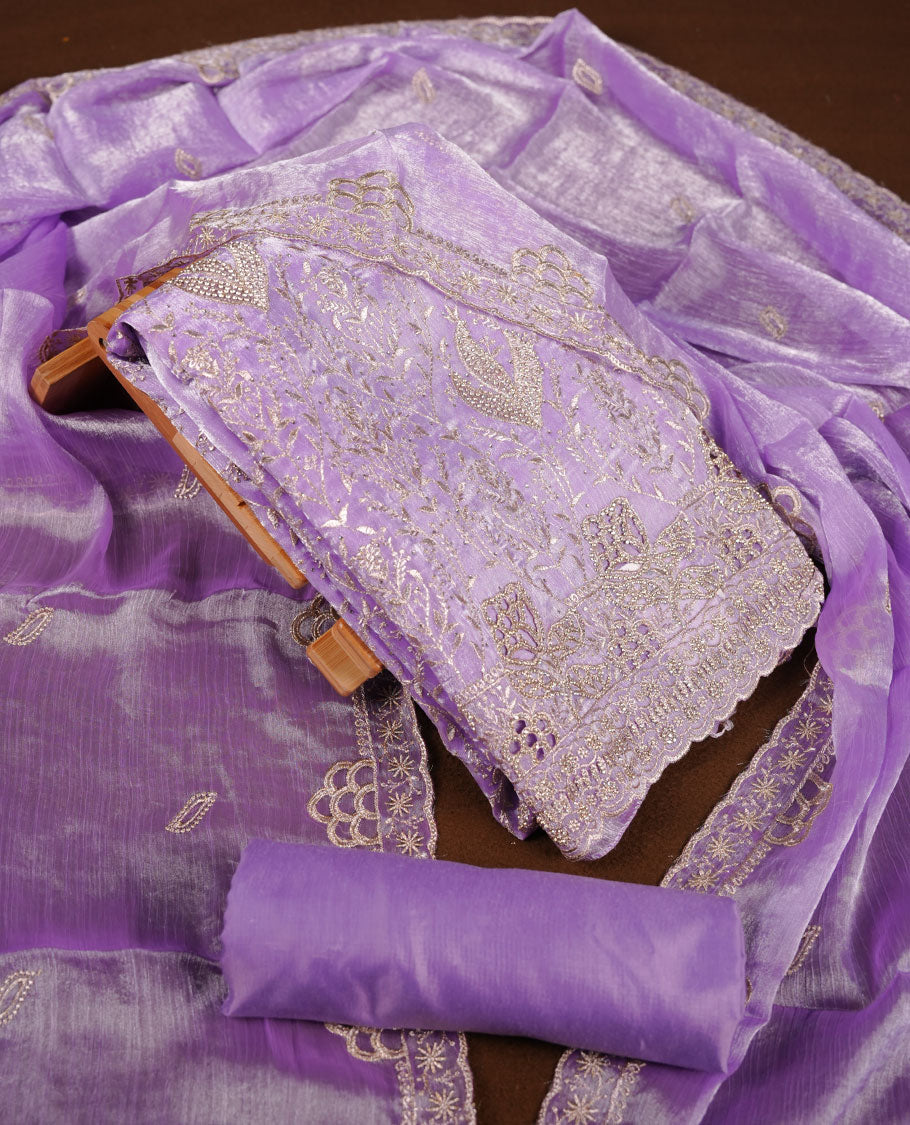 Lavender colour churidar set with stone and thread embroidery and detailing, paired with matching pant and dupatta.