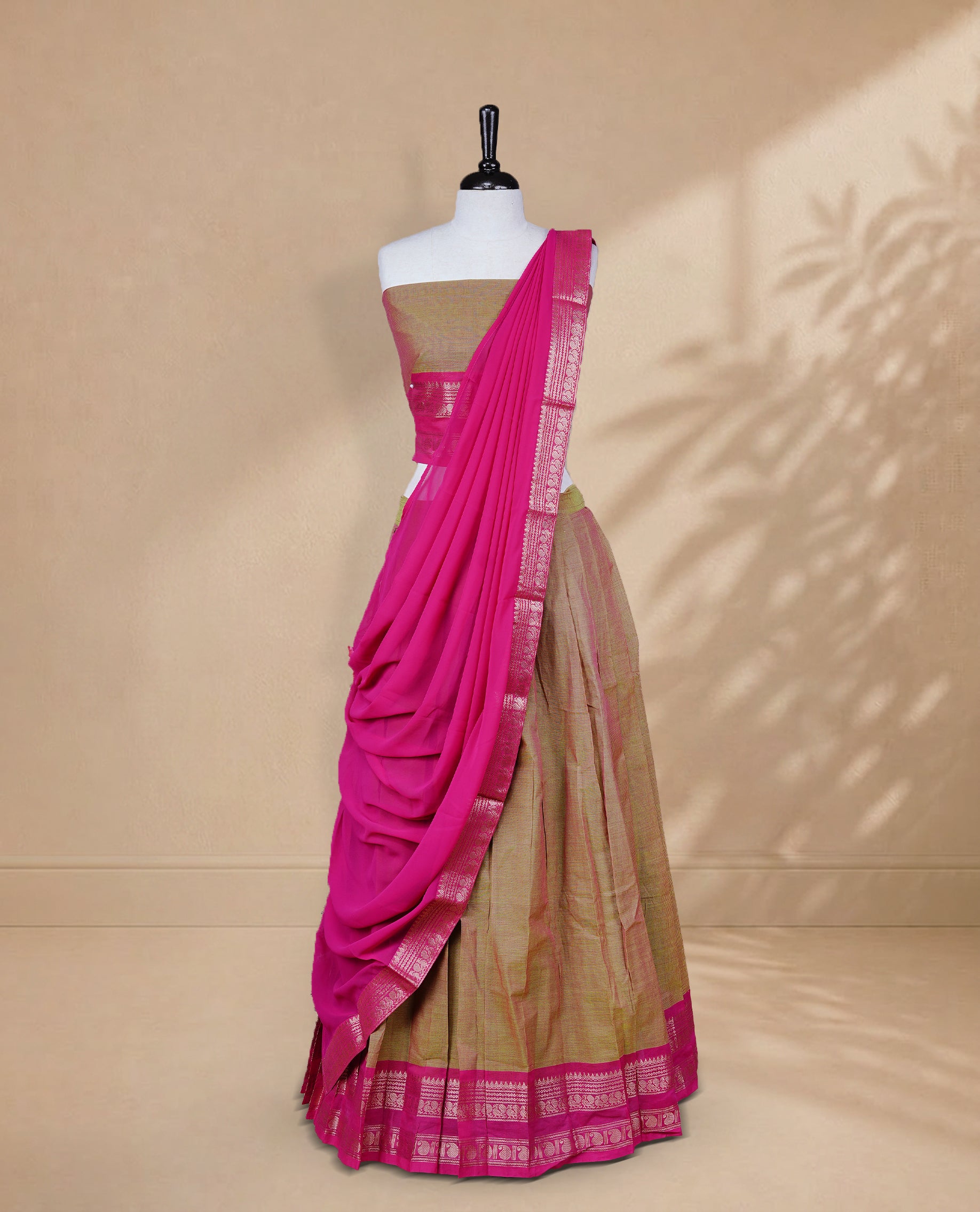 Olive & Pink double shade colour Half saree featuring Plain skirt with Zari border on contrast Pink colour border, Unstitched Blouse and matching dupatta.